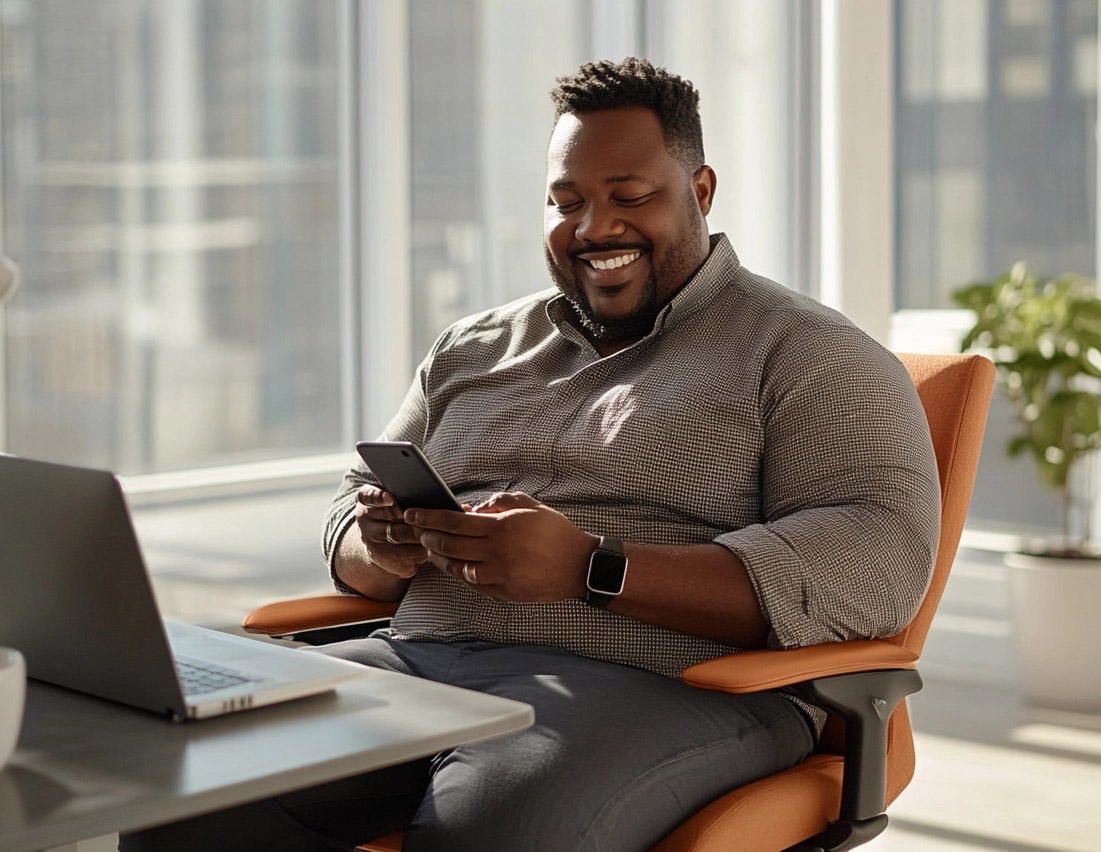 Man using smartphone in office
